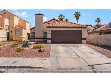 Charming single-story home with a two-car garage and desert landscaping at 5725 Cedar Ave, Las Vegas, NV 89110