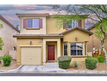 Charming two-story home showcasing a well-maintained front yard, warm exterior tones and inviting curb appeal at 6739 Twisted Wood Dr, Las Vegas, NV 89148