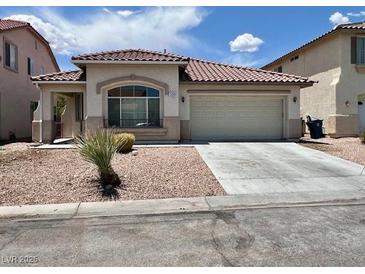 Charming single-story home with a two-car garage and low-maintenance desert landscaping at 3261 Monaco Shores Dr, Las Vegas, NV 89117