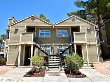 Inviting two-story condo with well-maintained landscaping and exterior stairs at 4682 Leeann Ln, Las Vegas, NV 89121