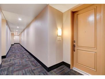 Condo hallway with colorful carpet and access to unit #505 at 27 E Agate Ave # 505, Las Vegas, NV 89123