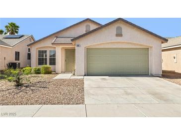 Charming single-story home featuring a two-car garage, low maintenance desert landscaping and neutral color palette at 5112 Foggia Ave, Las Vegas, NV 89130