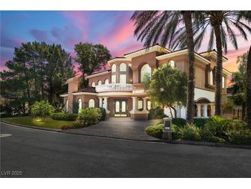 Stunning two-story home with lush landscaping and an elegant porte-cochere at 7 Rue Promenade Way, Henderson, NV 89011