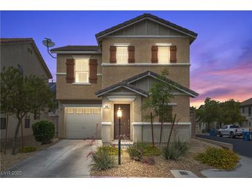 Charming two-story home features desert landscaping, a covered porch, and a two car garage at 106 Basketflower Ct, Las Vegas, NV 89183