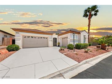 Charming single-story home featuring a two-car garage, mature landscaping, and inviting curb appeal at 10814 Franklin Hills Ave, Las Vegas, NV 89135