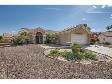 Single-story home with desert landscaping, tile roof, and two-car garage on a sunny day at 2401 Ocean Edge Ct, Las Vegas, NV 89134