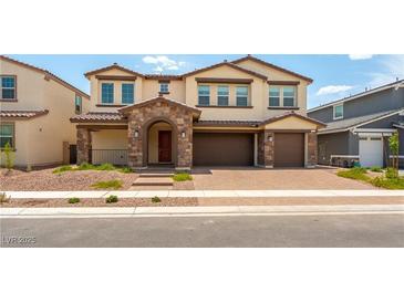 Charming two-story home featuring a stone archway, paver driveway, and a neutral color palette at 453 Winter Dove Ave, Henderson, NV 89011