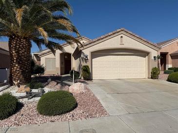 Charming single-story home with manicured landscaping, desert accents, and a convenient two-car garage at 495 Edgefield Ridge Pl, Henderson, NV 89012