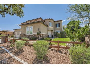 Inviting two-story home with stone accents and a well-manicured front yard at 6103 Sundown Crest St, Las Vegas, NV 89113