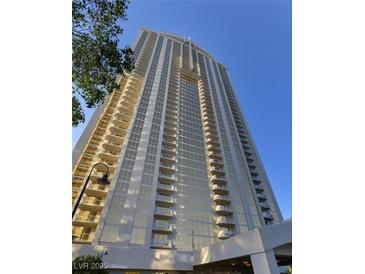 Stunning exterior view of a high-rise building with balconies and clear blue sky at 135 E Harmon Ave # 2303, Las Vegas, NV 89109