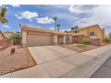 Charming single story home with desert landscaping and a two car garage at 1468 Harmony Hill Dr, Henderson, NV 89014