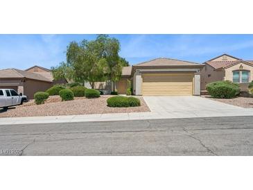 Charming single-story home featuring a well-maintained front yard with desert landscaping at 2026 Wildwood Lake St, Henderson, NV 89052