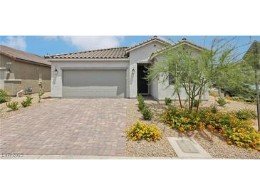 Charming single-story home with a well-maintained front yard and neutral color palette at 3024 River Brook Ct, Las Vegas, NV 89139