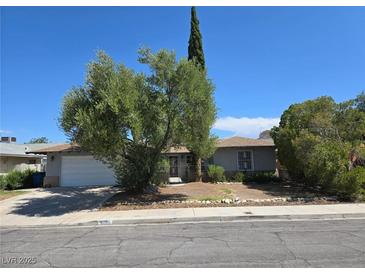 Charming single-story home with mature landscaping and a two-car garage in a quiet neighborhood at 6284 Explorer Dr, Las Vegas, NV 89103