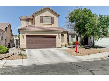Charming two-story home with a well-maintained front yard and a two-car garage in a residential neighborhood at 7137 Eyebright St, Las Vegas, NV 89131