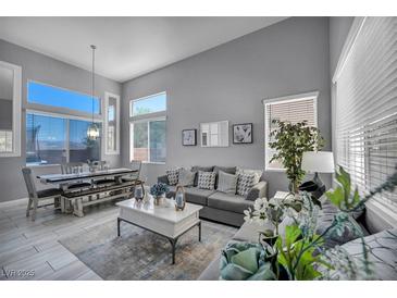 Bright living room features stylish decor, modern furniture, and plenty of natural light at 818 Grape Vine Ave, Henderson, NV 89002