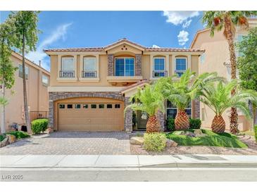 Stunning two-story home featuring a well-maintained lawn and a two-car garage at 9729 Hawk Crest St, Las Vegas, NV 89141