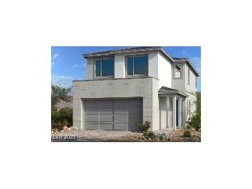 Beautiful two-story home with modern architectural details and an integrated two-car garage at 1547 Pacific Baza St, Las Vegas, NV 89138
