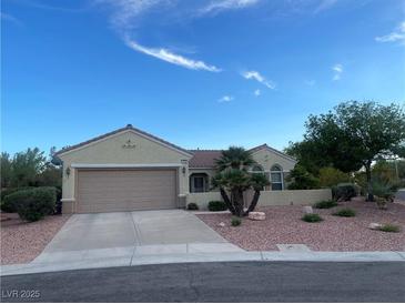 Charming single-story home featuring a desert landscape, large two-car garage, and inviting curb appeal at 1620 Fieldbrook St, Henderson, NV 89052