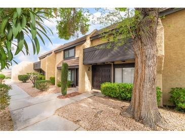 Charming townhome showcasing desert landscaping and a cozy, inviting front entryway at 3221 Yolanda Ln, Las Vegas, NV 89121