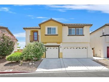 Inviting two-story home featuring a two-car garage, desert landscaping, and sunny curb appeal at 3689 Bufflehead St, Las Vegas, NV 89122