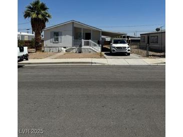 Charming single-story home with a covered carport and well-maintained front yard at 237 Piute Ln, Henderson, NV 89015