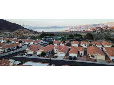 Lakefront community boasts charming single-Gathering homes and lush landscaping with a breathtaking mountain backdrop at 390 Montego Ln, Boulder City, NV 89005