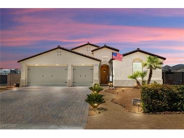 Charming single-story home featuring a tile roof, two-car garage, and well-manicured front yard at 4620 E Suntree Ct, Pahrump, NV 89061