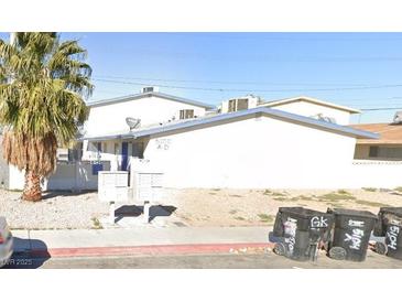 Low rise building with blue and white trim and desert landscaping in a sunny location at 5104 Pebble Beach Blvd, Las Vegas, NV 89108