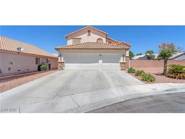 Charming two-story home featuring a three-car garage and well-maintained landscaping at 690 Great Dane Ct, Henderson, NV 89052