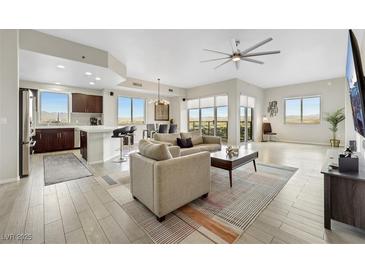 Bright living room featuring stylish furniture, open layout, and scenic views through large windows at 8255 Las Vegas Blvd # 1821, Las Vegas, NV 89123
