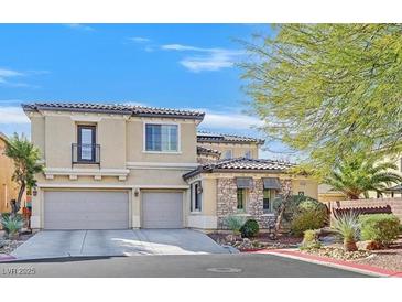 Beautiful two-story home with a two-car garage and well-maintained landscaping at 10001 Blairwood Ct, Las Vegas, NV 89178