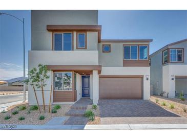 Modern two-story home boasts a two-car garage, desert landscaping, and contemporary design at 10184 Juniper Valley St, Las Vegas, NV 89166