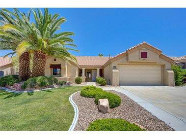 Charming single story home with mature landscaping including a beautiful palm tree in the front yard at 2808 Crown Ridge Dr, Las Vegas, NV 89134