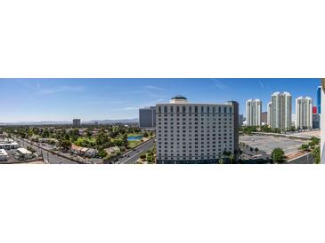 Expansive city view showcases tall buildings, a golf course, and nearby mountains at 322 Karen Ave # 1106, Las Vegas, NV 89109