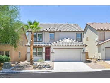 Charming two-story home with a well-maintained front yard, palm tree, and attached two-car garage at 6133 Roseboro Ct, North Las Vegas, NV 89081