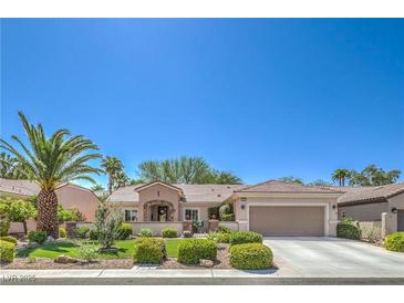 Charming single-story home showcasing a well-manicured lawn and desert landscaping at 2225 Blackburn Hills Ave, Henderson, NV 89044