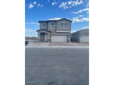 Two-story home featuring a two-car garage and neutral color palette at 4205 Mount Bonnell Ave, North Las Vegas, NV 89081