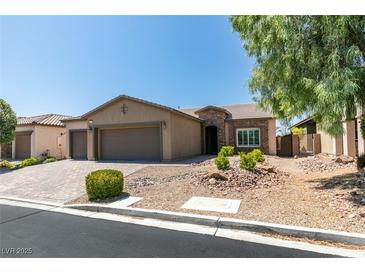 Charming single-story home with a three-car garage and well-maintained desert landscaping at 6085 Ryan Ranch Ave, Las Vegas, NV 89130