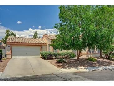 Charming single-story home with mature landscaping and a two-car garage, perfect for comfortable living at 7616 Yondering Ave, Las Vegas, NV 89131