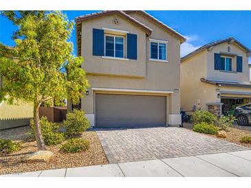 Charming two-story home with a landscaped yard and a two-car garage at 8295 Nebula Cloud Ave, Las Vegas, NV 89131