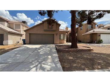 Charming single-Gathering home featuring a two-car garage and low-maintenance landscaping at 1081 Overture Dr, Las Vegas, NV 89123