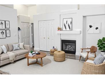 Bright living room features fireplace, modern décor, and a comfortable seating area at 1624 N Torrey Pines Dr # 101, Las Vegas, NV 89108