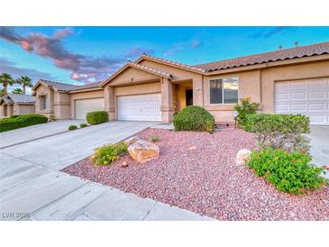Charming single story home featuring desert landscaping, attached garage and inviting curb appeal at 200 Teller St, Henderson, NV 89074