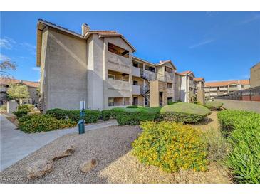 Condo complex exterior features well-maintained landscaping, multiple levels and stairs to upper units at 4200 S Valley View Blvd # 2009, Las Vegas, NV 89103