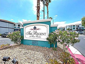 Inviting entrance sign at The Regent at Town Center with lush landscaping and well-maintained grounds at 6955 N Durango Dr # 1022, Las Vegas, NV 89149