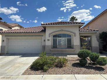 Charming single-story home featuring a tile roof, two-car garage, and well-maintained front yard at 8337 Ruby Heights Ave, Las Vegas, NV 89117