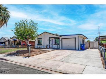 Charming single-story home featuring a well-maintained yard, mature tree, and a private driveway at 4432 Ash Ave, Las Vegas, NV 89110