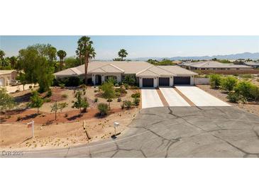Stunning single-story home boasts mature landscaping, a three-car garage, and a spacious driveway at 8290 Gagnier Blvd, Las Vegas, NV 89113