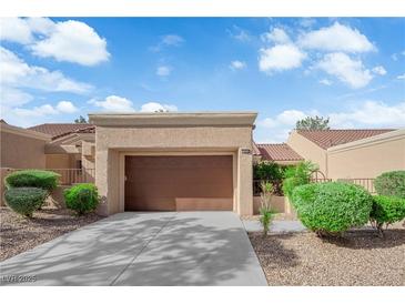 Charming one-story home features an attached garage, desert landscaping, and a well-maintained exterior at 9424 Gold Mountain Dr, Las Vegas, NV 89134